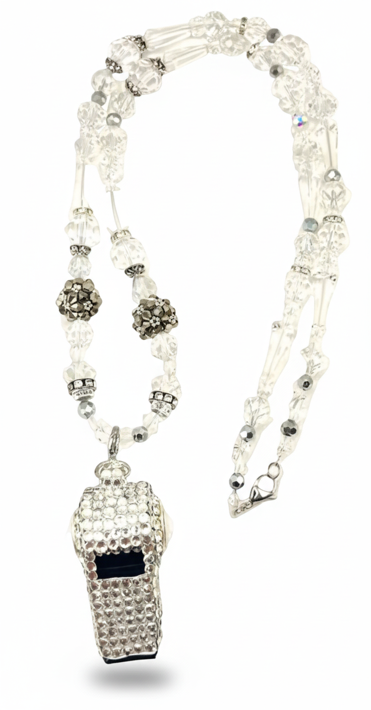 Necklace with a rhinestone-encrusted whistle pendant on a white background
