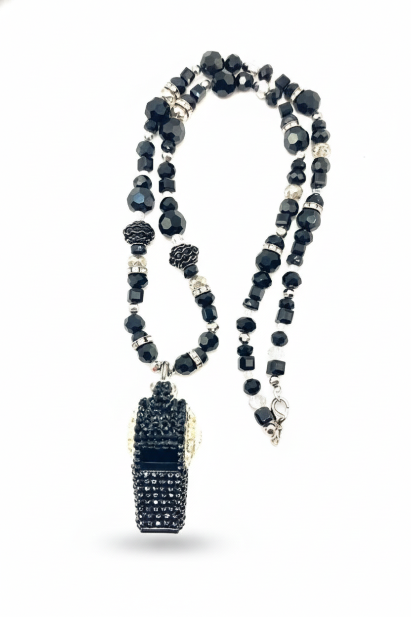 Necklace with black beads and a clasp on a white background