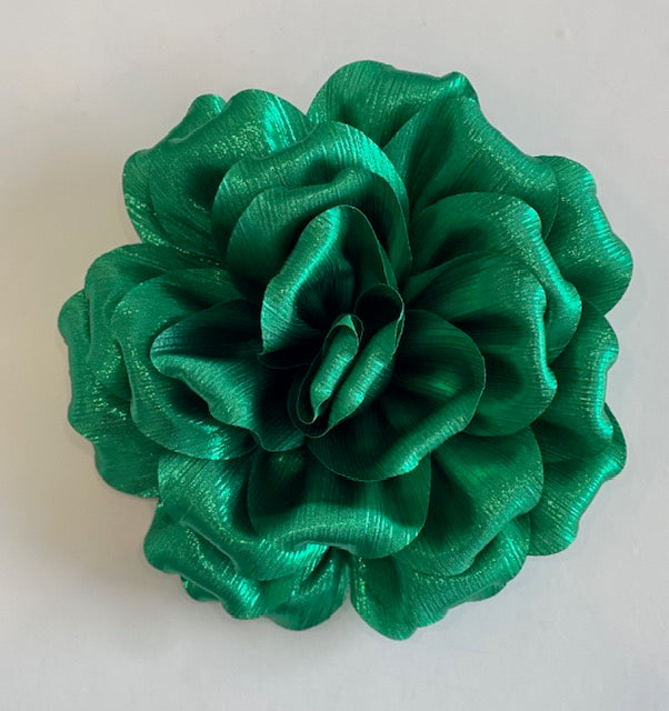 Green metallic flower on a white background