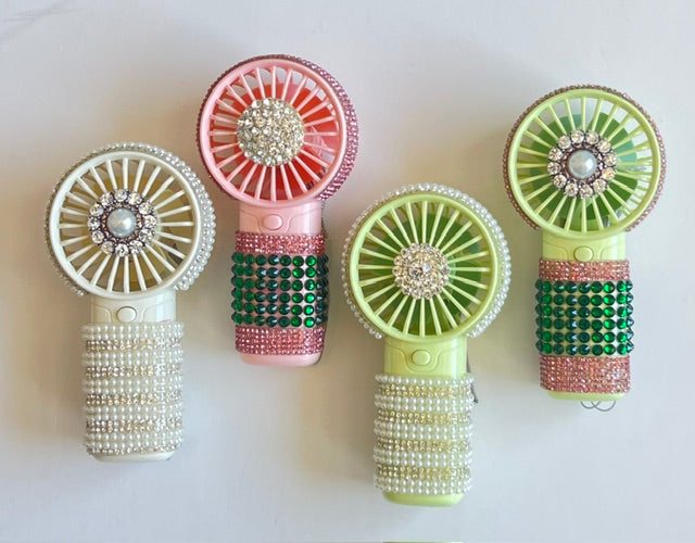 Four decorative hand fans with beaded designs on a white background